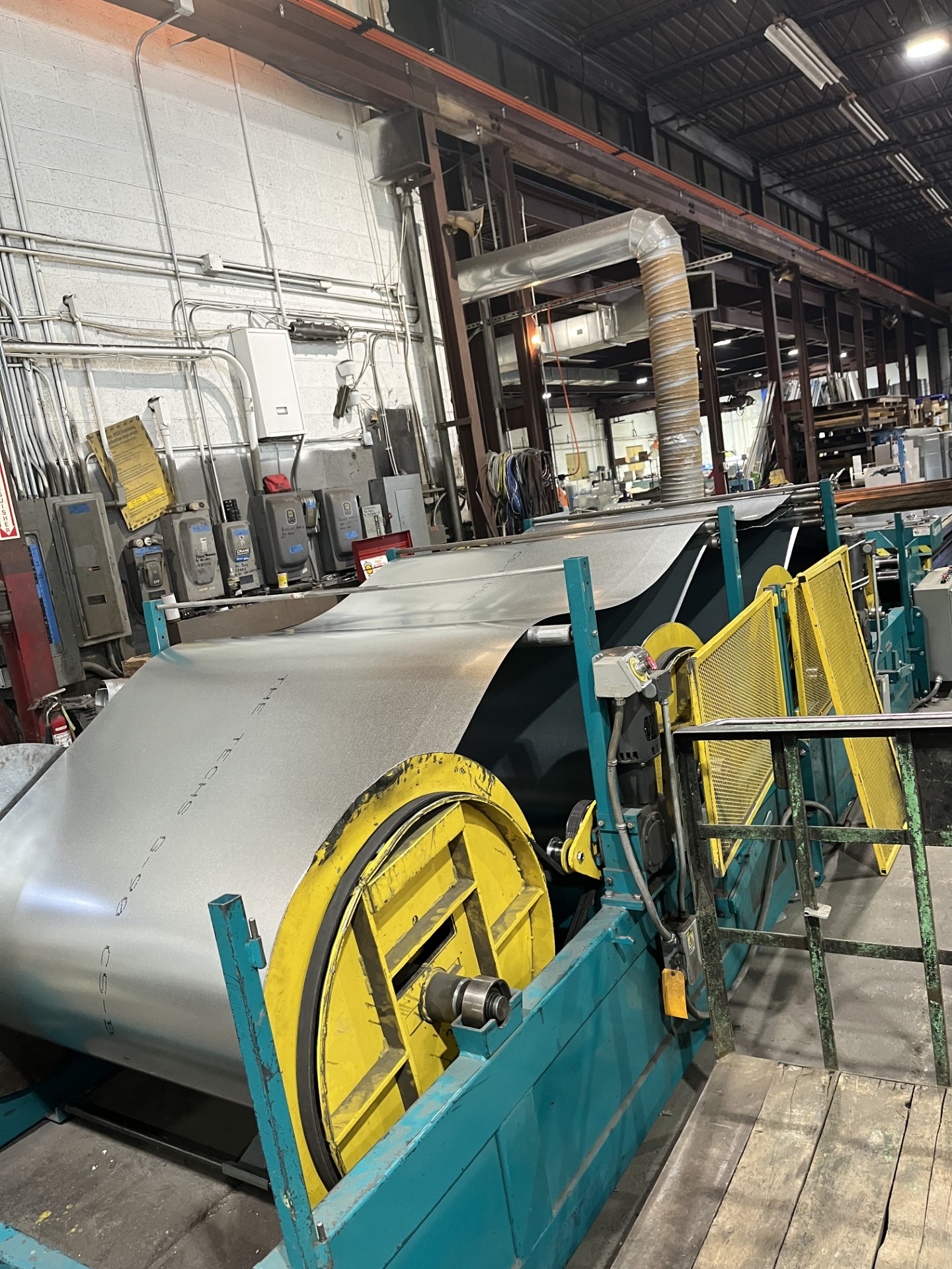 Entry section of coil processing line with safety guarding and galvanized steel sheet
